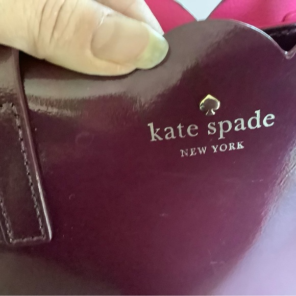 Kate Spade beautiful plum in a vinyl material . In pre owned condition. - Picture 7 of 7
